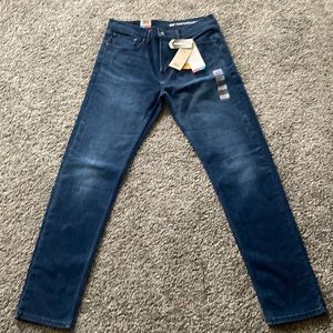Mens LEVIS 502 Tapered jeans size 32x34